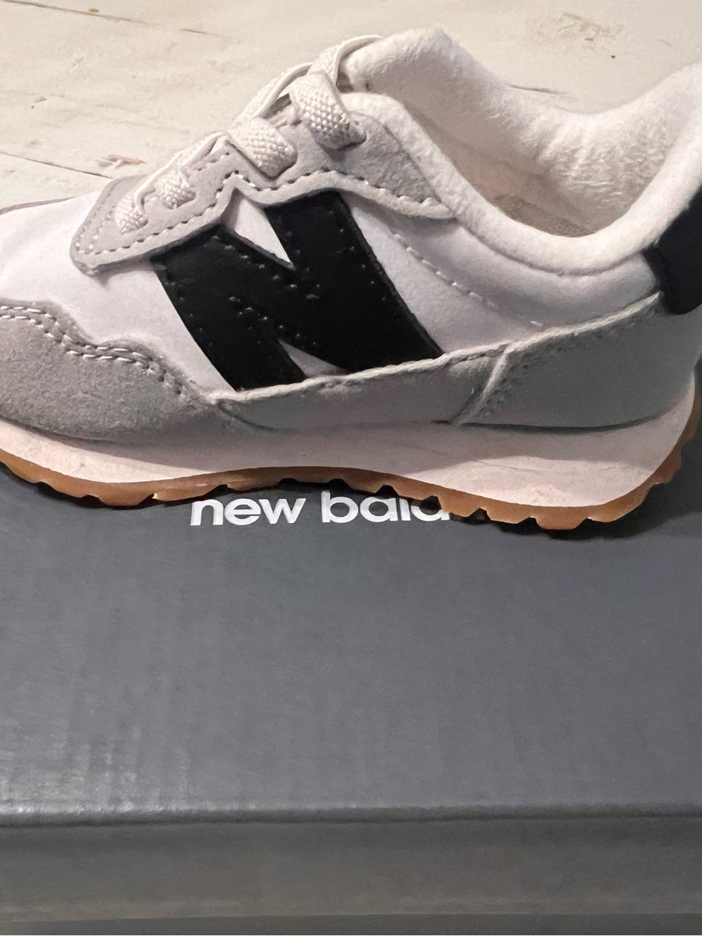 New Balance Kids White and Black Sneaker with Gum Sole